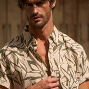Model wearing Short Sleeve Print Linen Cotton Shirt in Four Leaf Clover, showcasing abstract print and relaxed fit.
