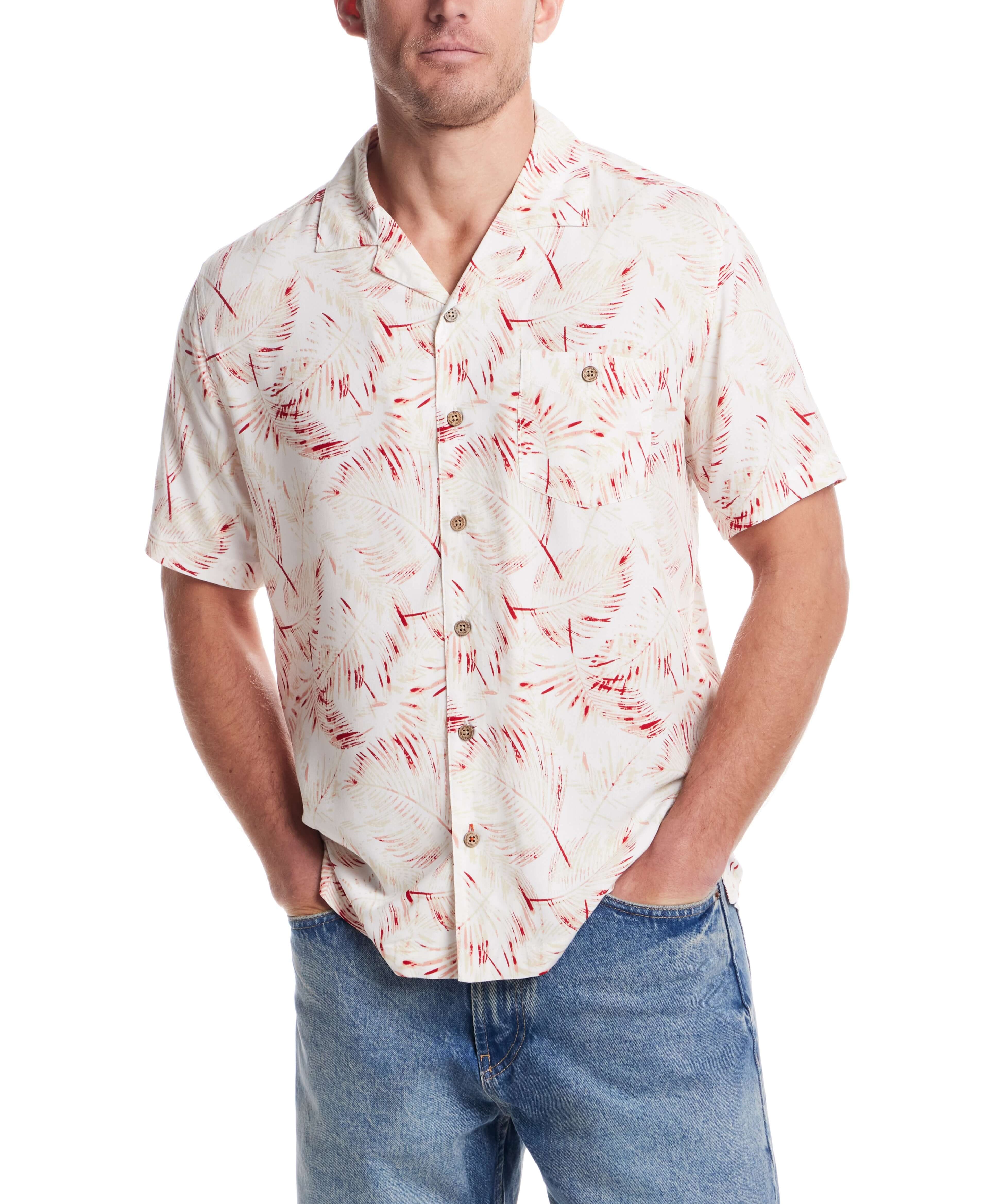 Short sleeve rayon printed camp shirt in dusty pink with retro pattern, styled with relaxed fit and denim.