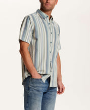 Short Sleeve Seersucker Stripe in Green Slate worn by a model, showcasing its vertical stripe pattern and button-down collar.