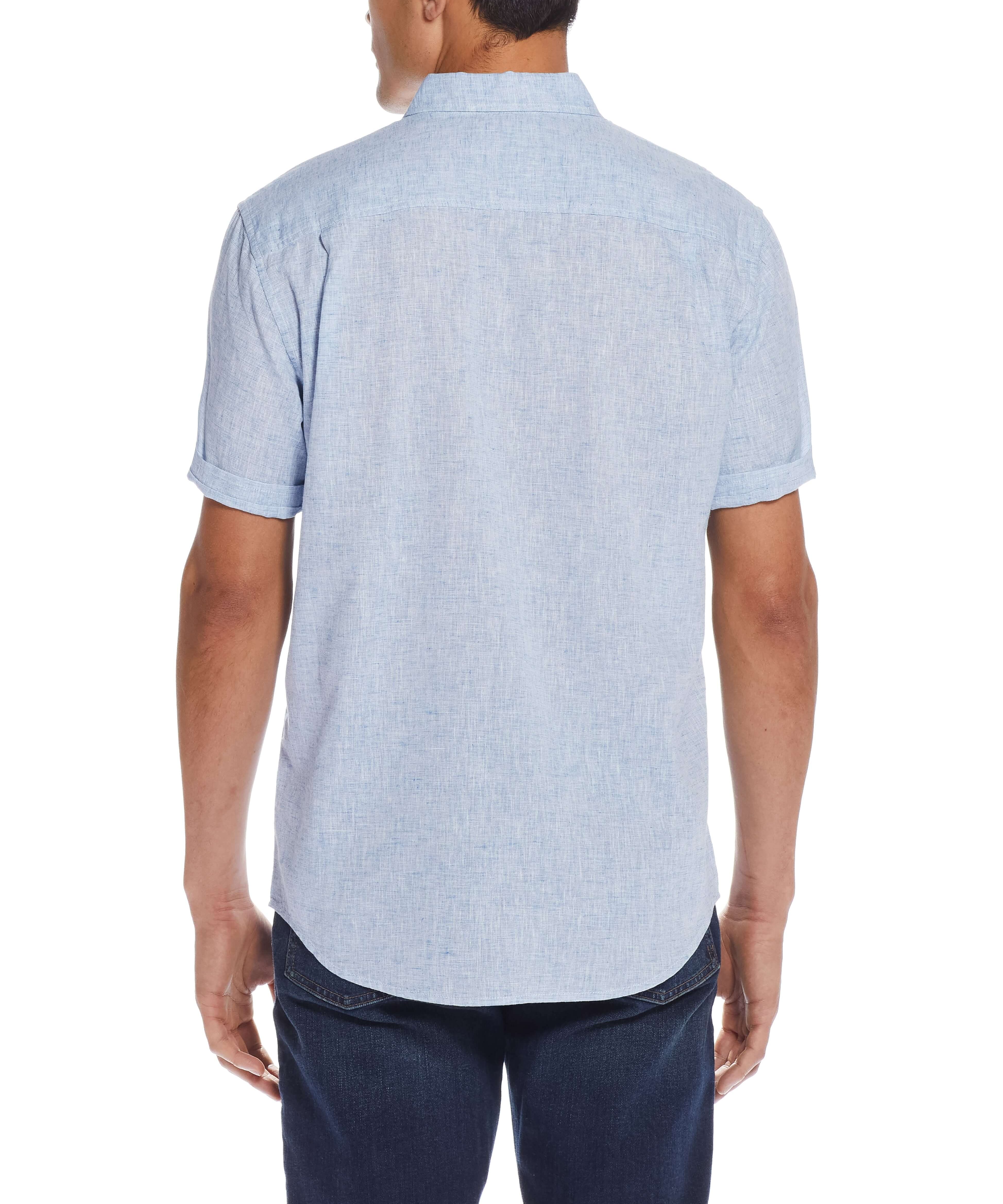 Back view of a man wearing a short sleeve solid linen cotton shirt in Cendre Blue, showcasing its relaxed fit.