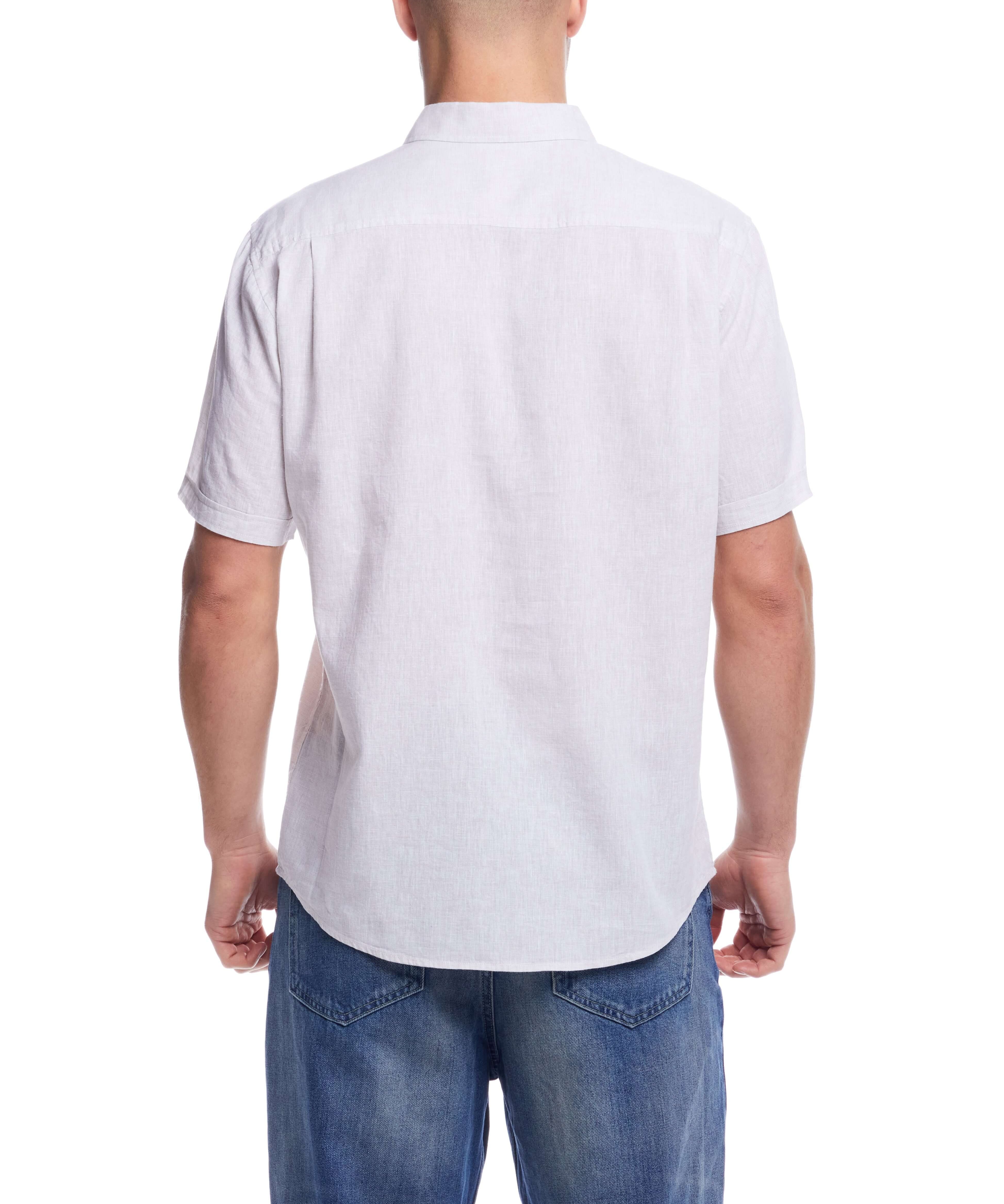 Back view of a man wearing a short sleeve solid linen cotton shirt in natural color, perfect for casual wear.