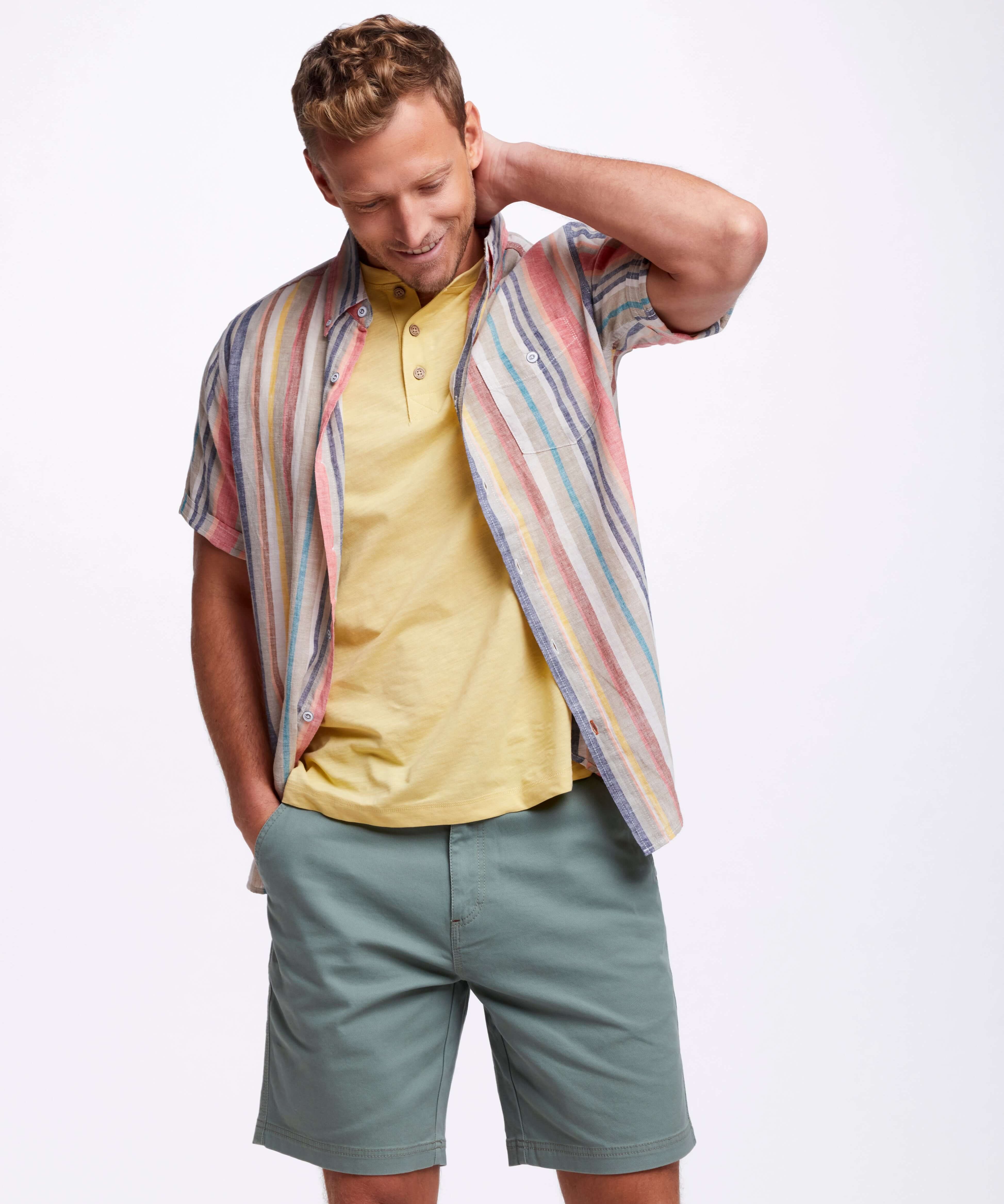 Model wearing Short Sleeve Stripe Linen Cotton Shirt In Peach Echo with relaxed fit and short sleeves.