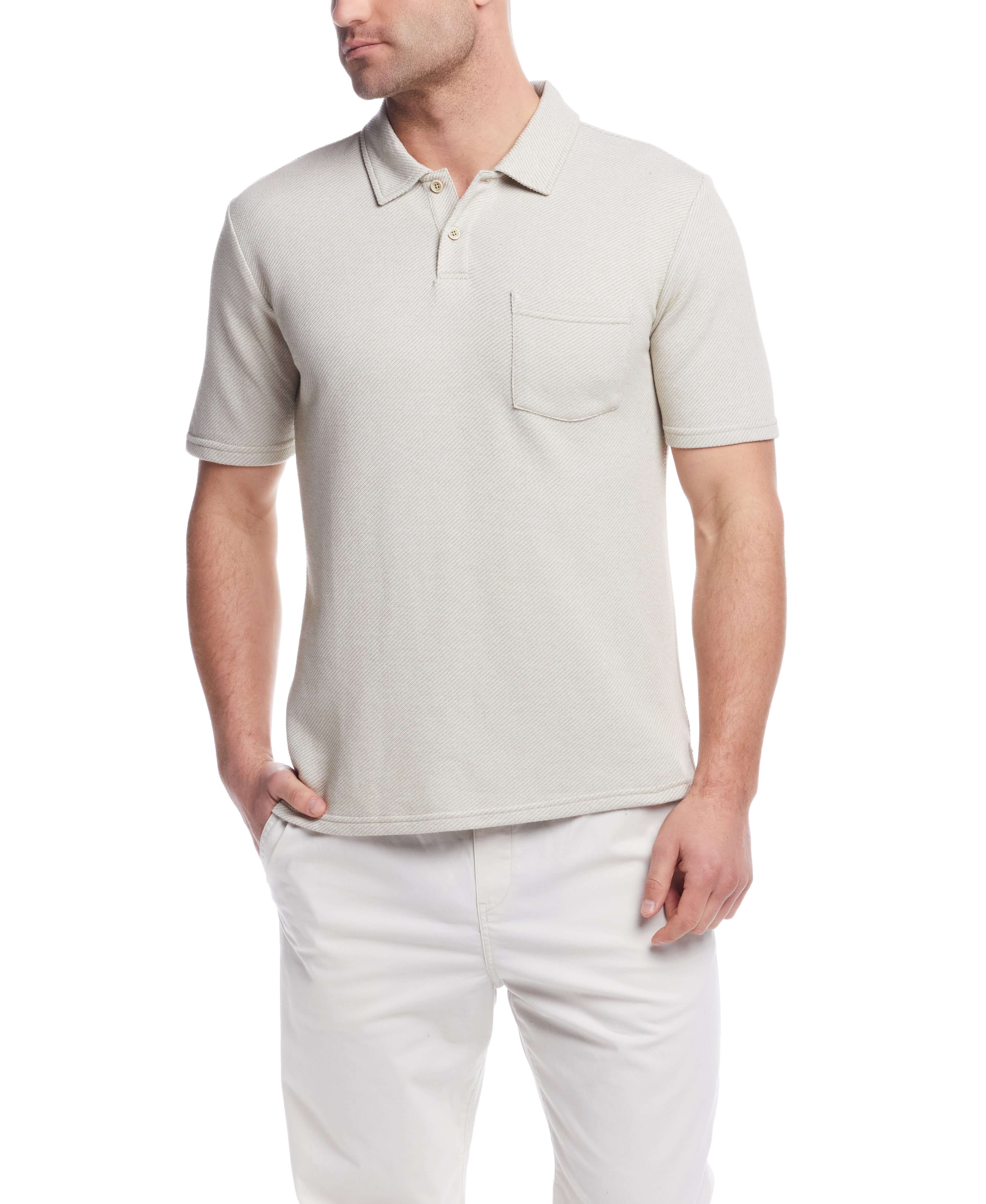 Short Sleeve Twill Polo in Natural, featuring a classic design with chest pocket and two-button placket, model wearing size Large.