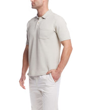 Short sleeve twill polo in natural color, featuring a chest pocket and classic 2 button placket.
