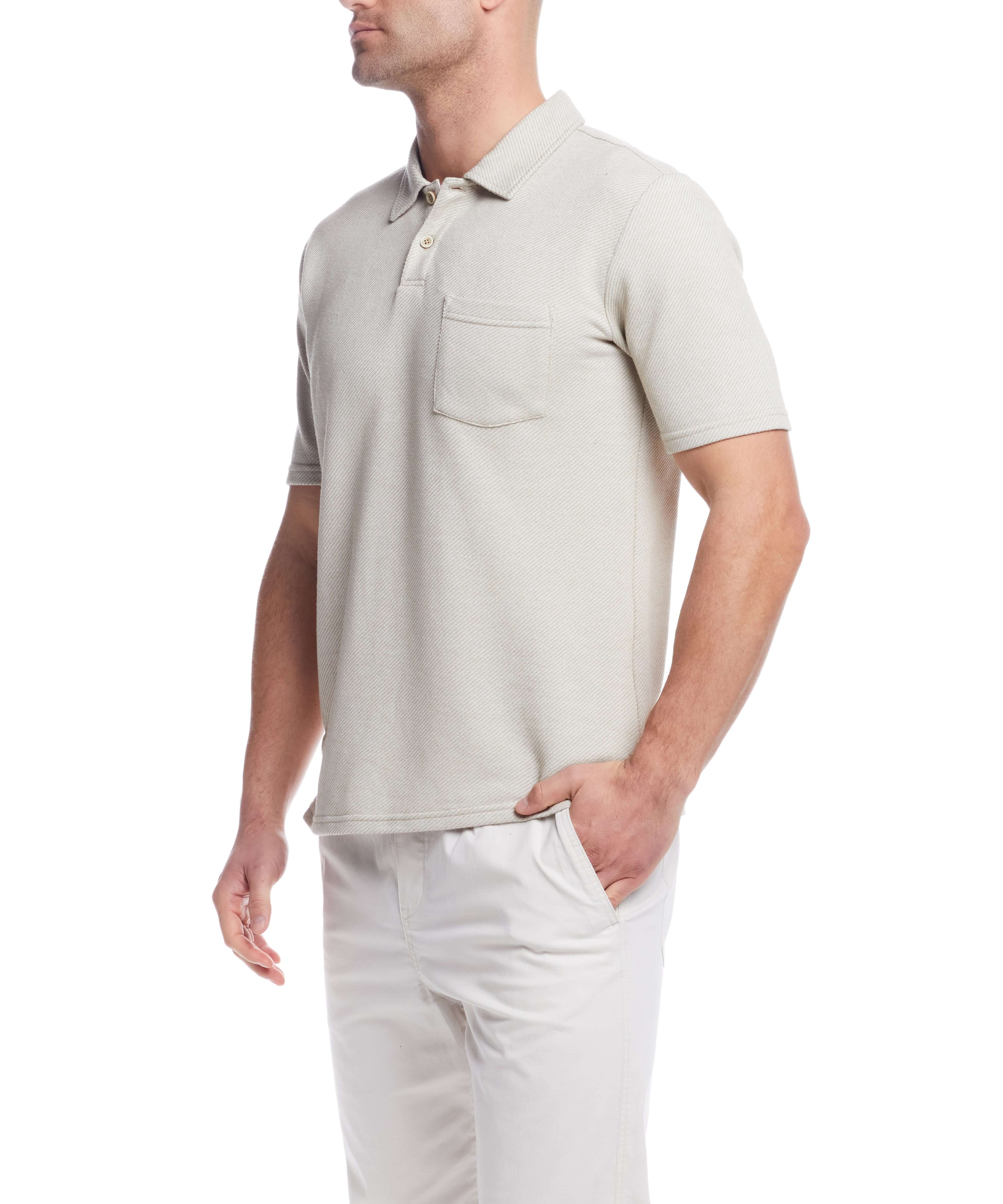 Short sleeve twill polo in natural color, featuring a chest pocket and classic 2 button placket.