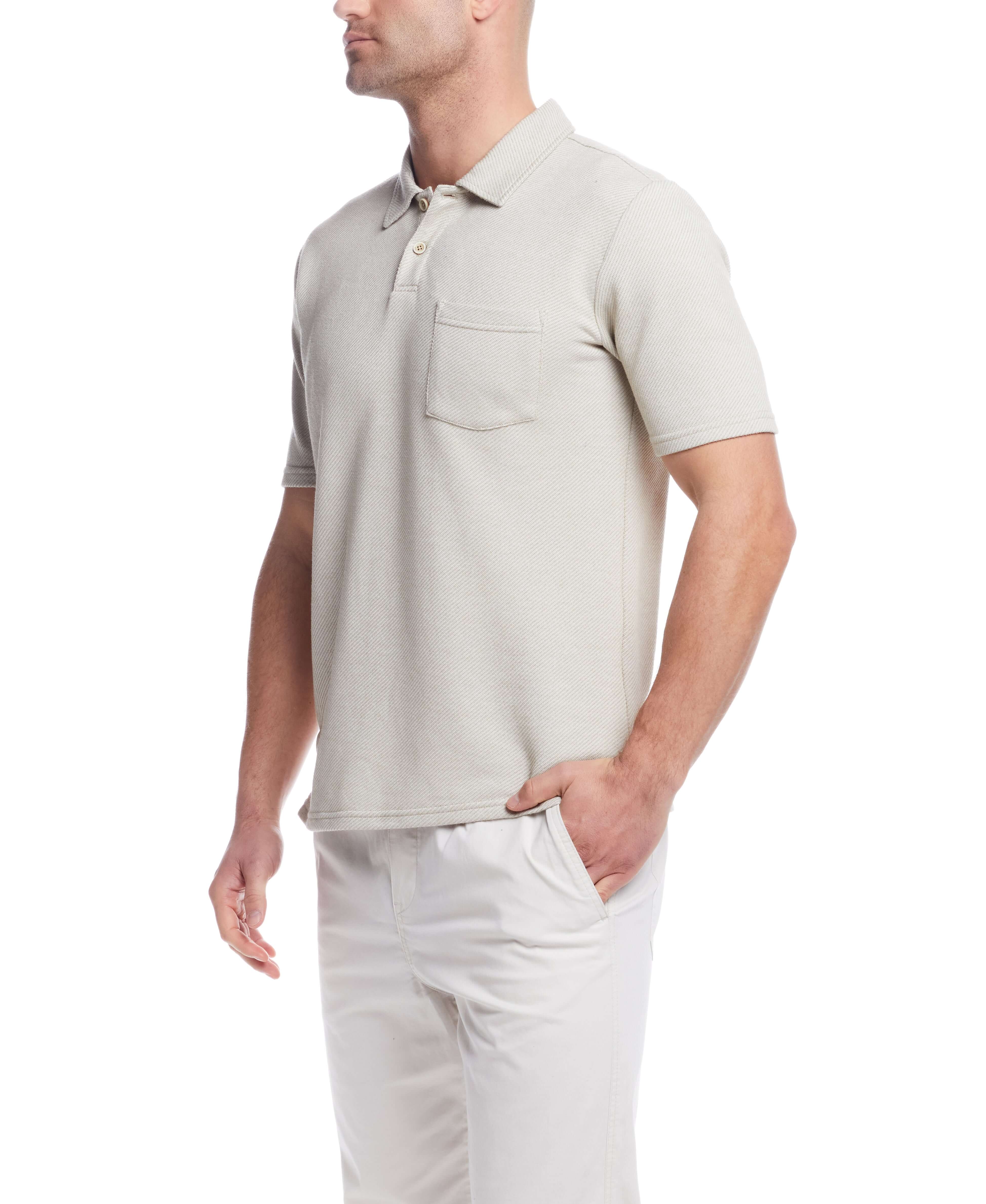 Short sleeve twill polo in natural color, featuring a chest pocket and classic 2 button placket.