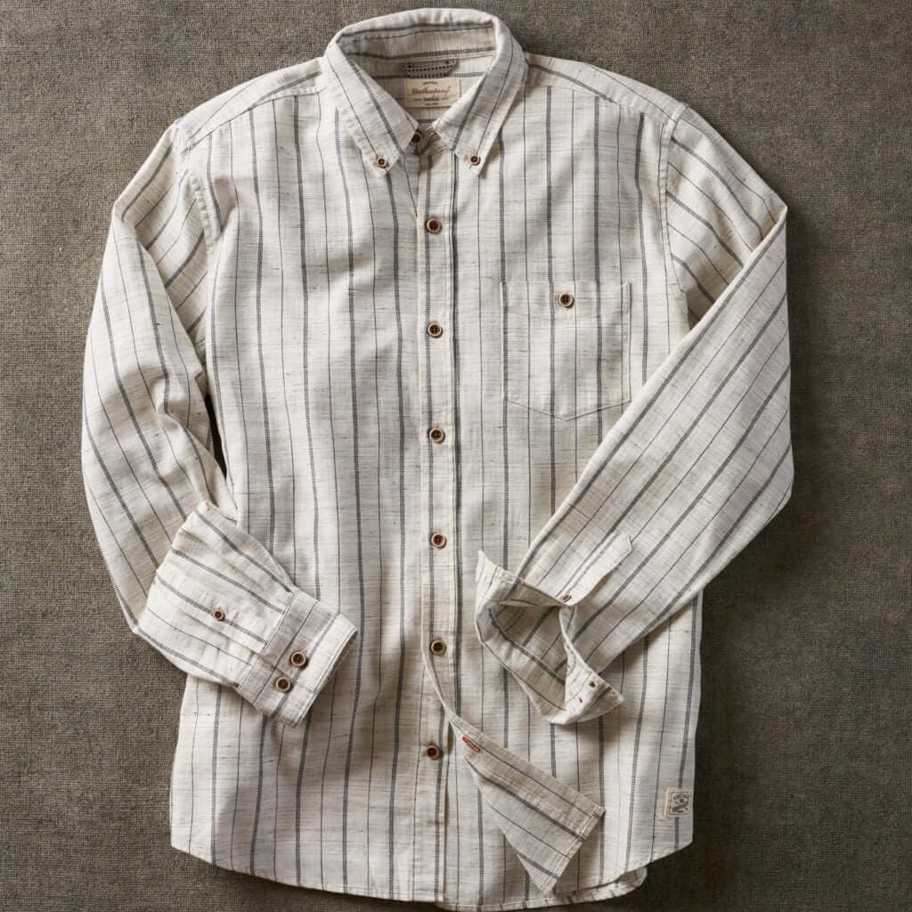 Long sleeve ecru textured shirt featuring subtle stripes, button-down collar, and chest pocket.