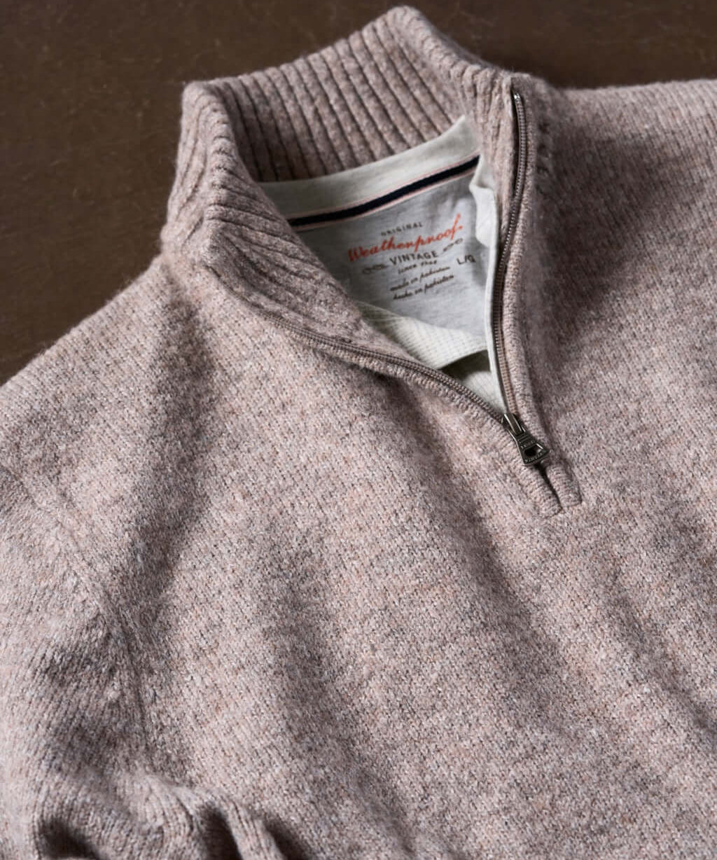 Fuzzy taupe quarter zip sweater featuring a classic mock neck and ribbed cuffs, perfect for cozy layering on cooler days.