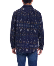 Back view of a man wearing a Southwest Jacquard Shirt Jacket in blue moss, showcasing the intricate southwestern pattern.
