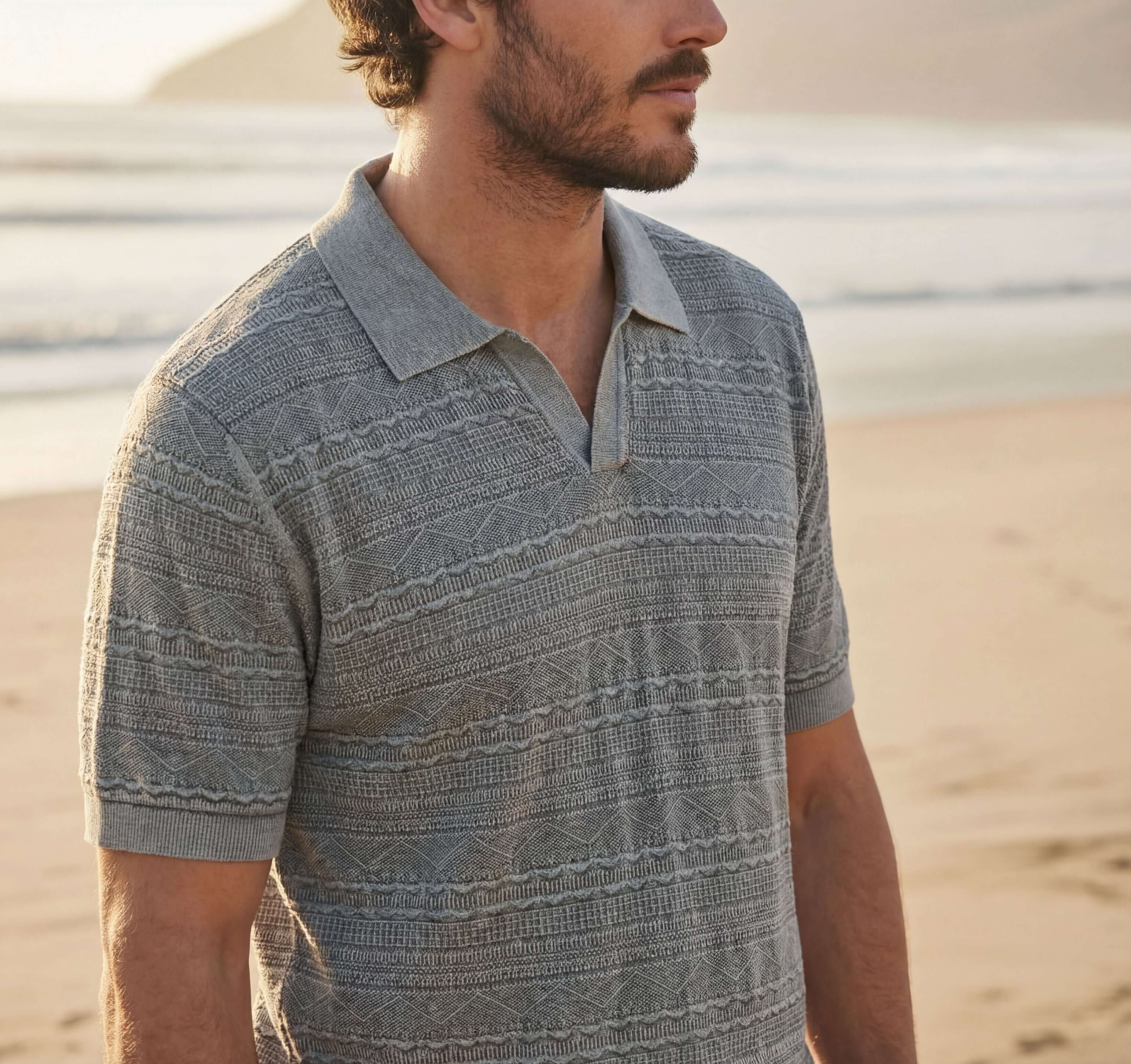 Stonewash Knit Johnny Collar Polo in Flint model on the beach, showcasing a textured knit design.
