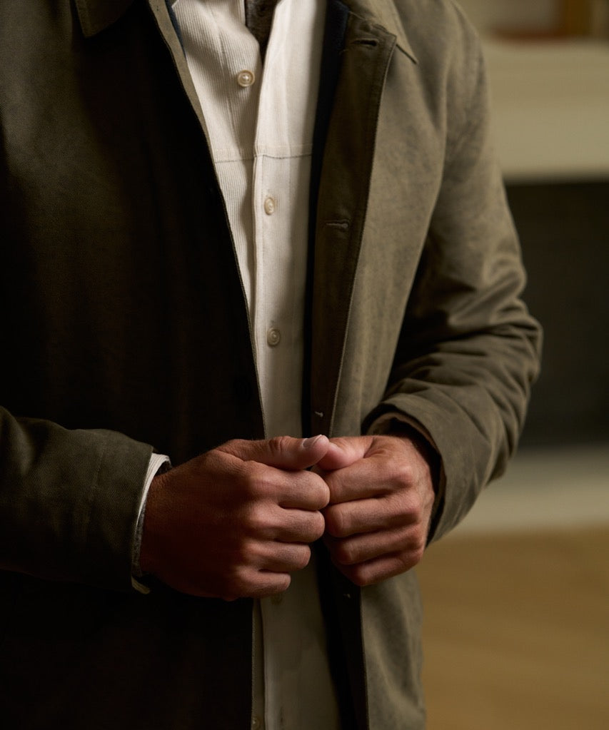 Sueded Jacket in Olive displayed on a model, showcasing the button-up design and subtle texture.