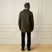 Sueded Jacket in Olive worn by a model, showcasing the back view and stylish design.