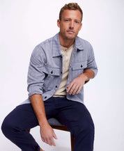 Model wearing a Summer Shirt Jacket In Navy, featuring a button front, patch pockets, and a relaxed fit.