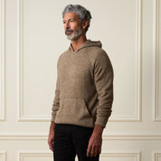 Man wearing a Sweater Knit Hoodie in Brown, showcasing pullover style and front pouch pocket against a neutral background.