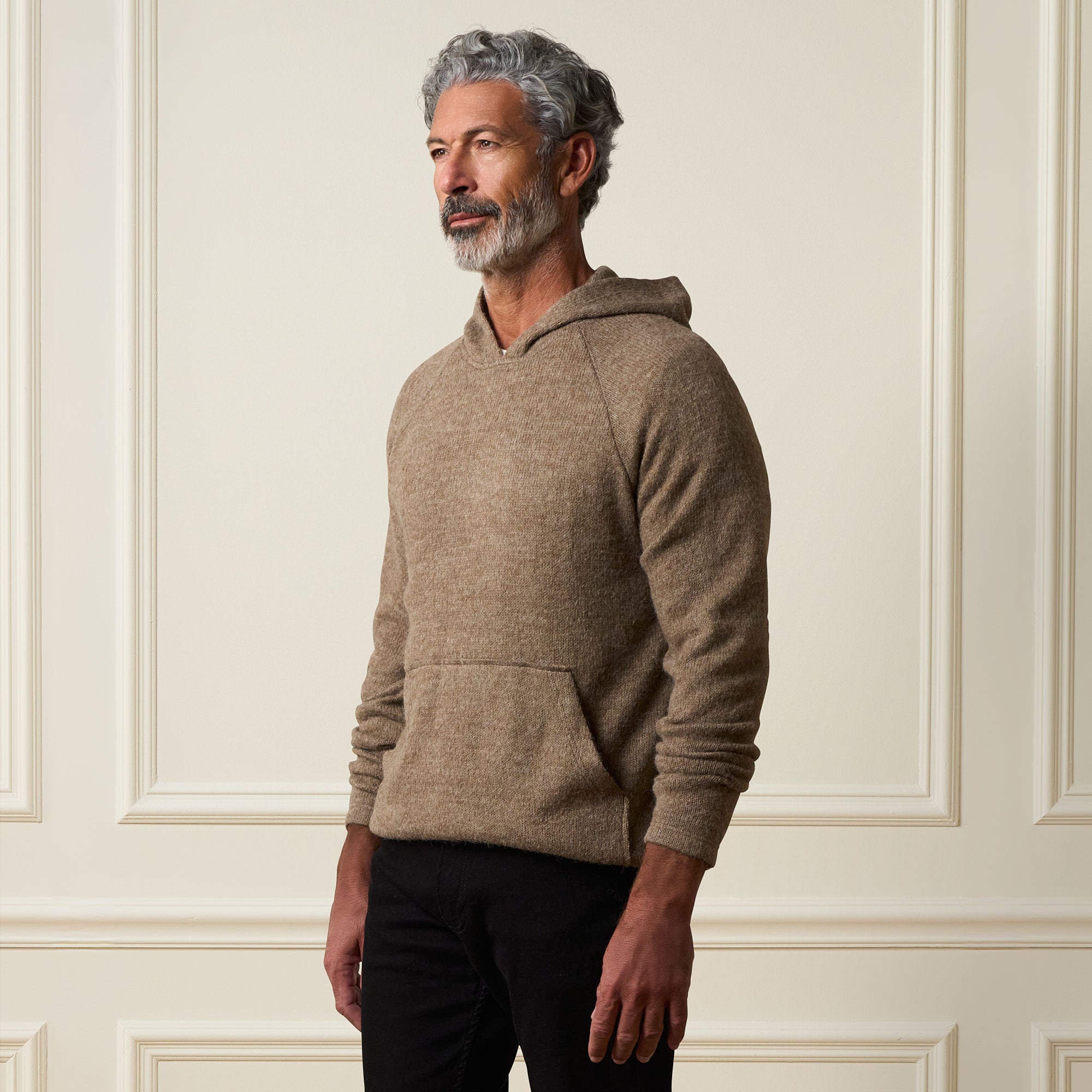 Man wearing a Sweater Knit Hoodie in Brown, showcasing pullover style and front pouch pocket against a neutral background.