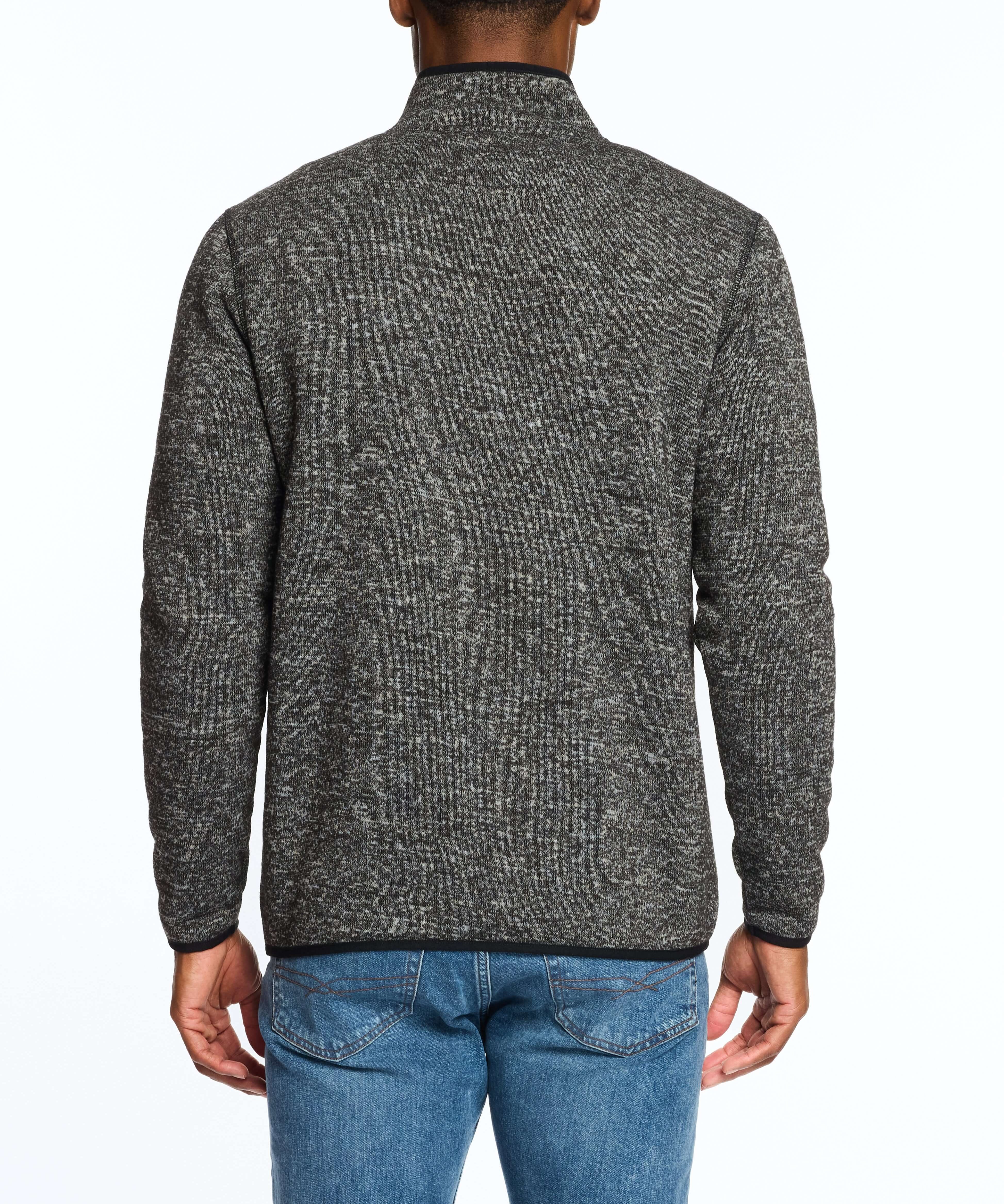 Back view of a man wearing a Meteorite sweaterfleece pullover with sherpa trim, showcasing warmth and style.