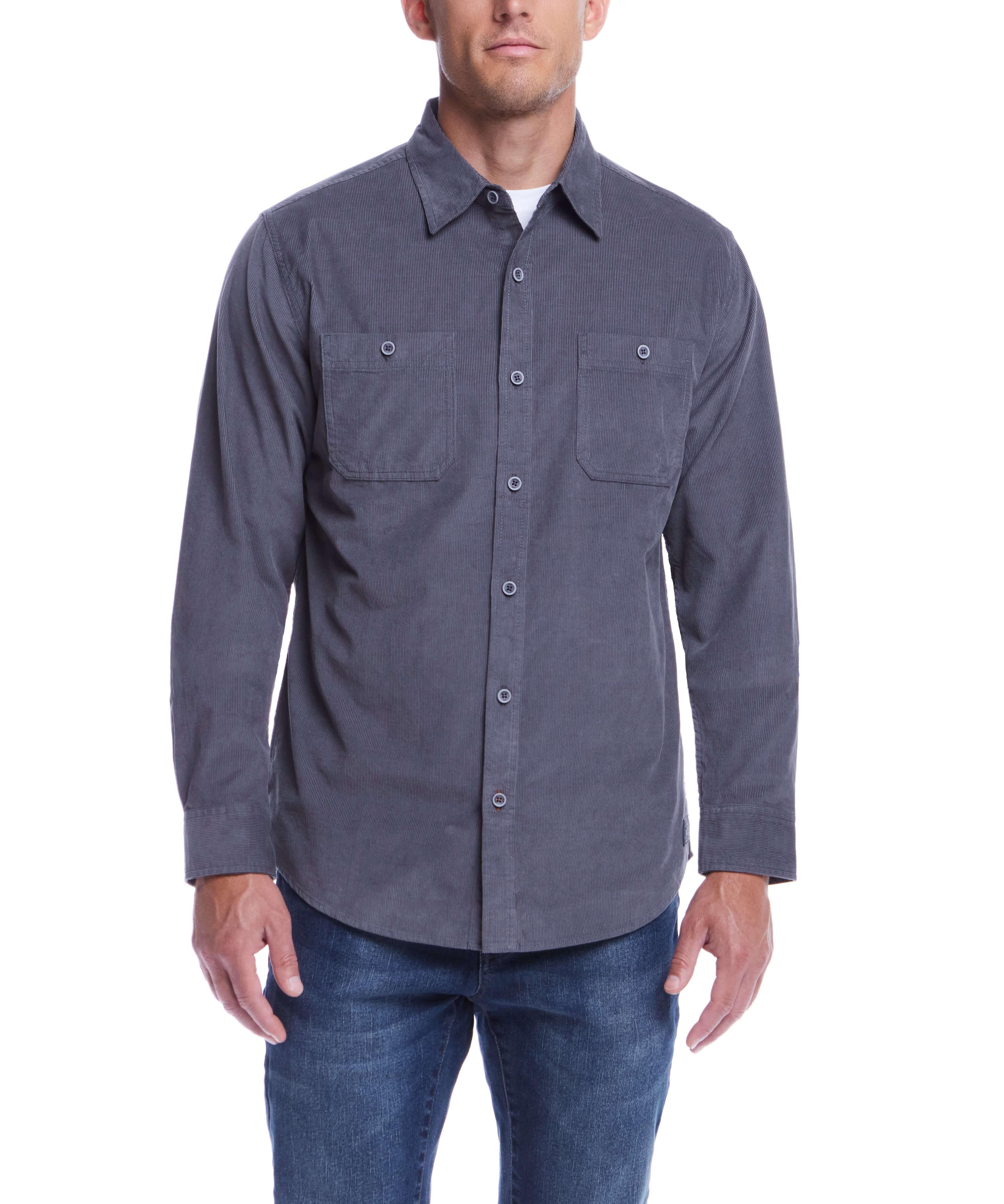 Man wearing a thin wale solid cord shirt in poppy seed color with button-down front and two chest pockets.