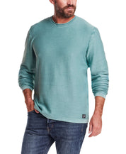 Twill Stonewash Sweater in Adriatic Blue worn by a model, highlighting its classic roll-neck design and airy texture.
