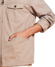 Twill Trucker In Vintage Khaki showing the front buttoned patch pocket and slanted side welt pockets.