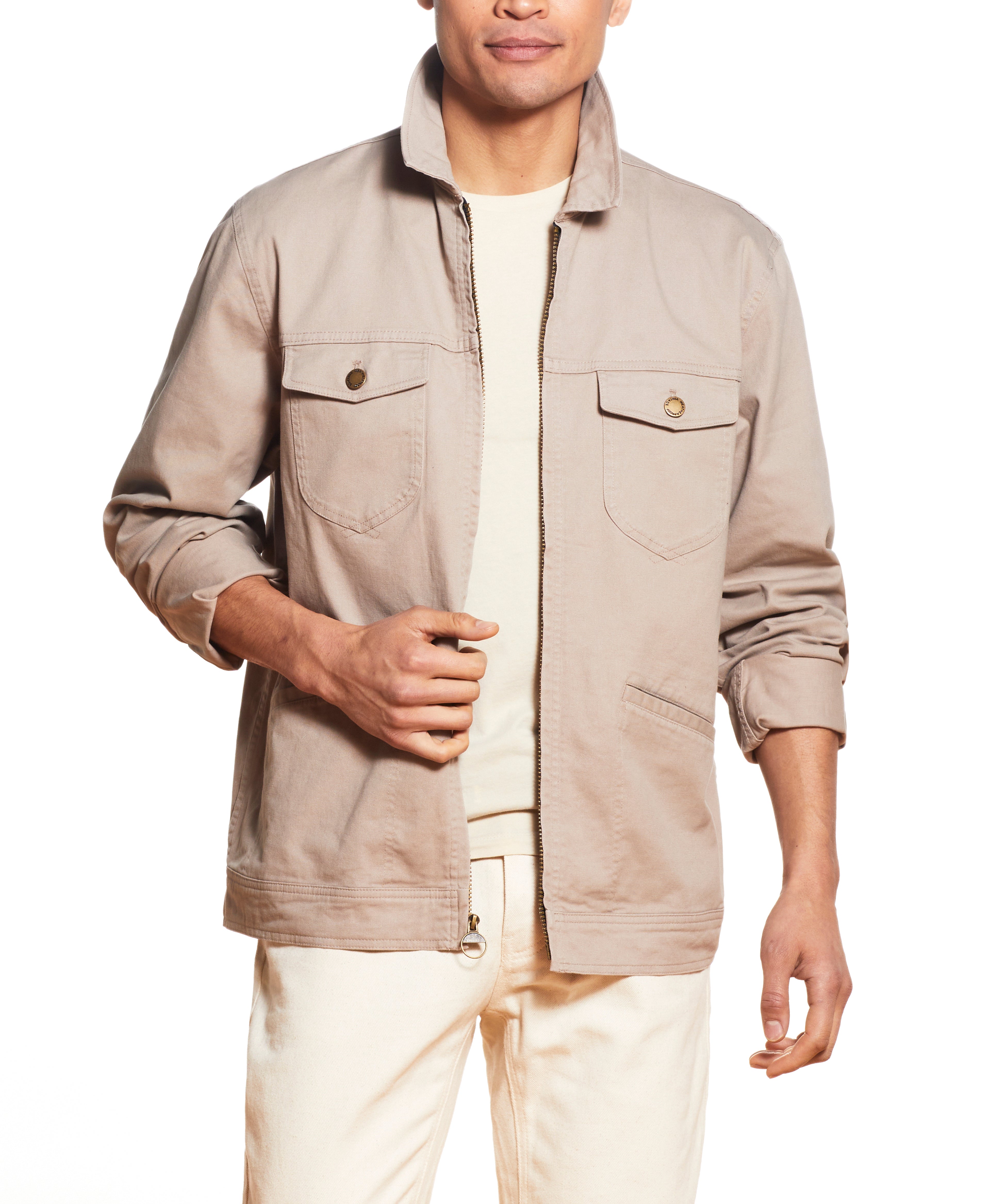 Model wearing Twill Trucker In Vintage Khaki jacket, featuring front buttoned patch pockets and comfort fit.