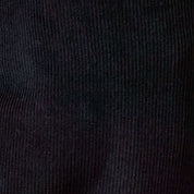Close-up texture of Two-Tone Cord 5 Pocket Pants in Black showing soft cotton-blend corduroy.