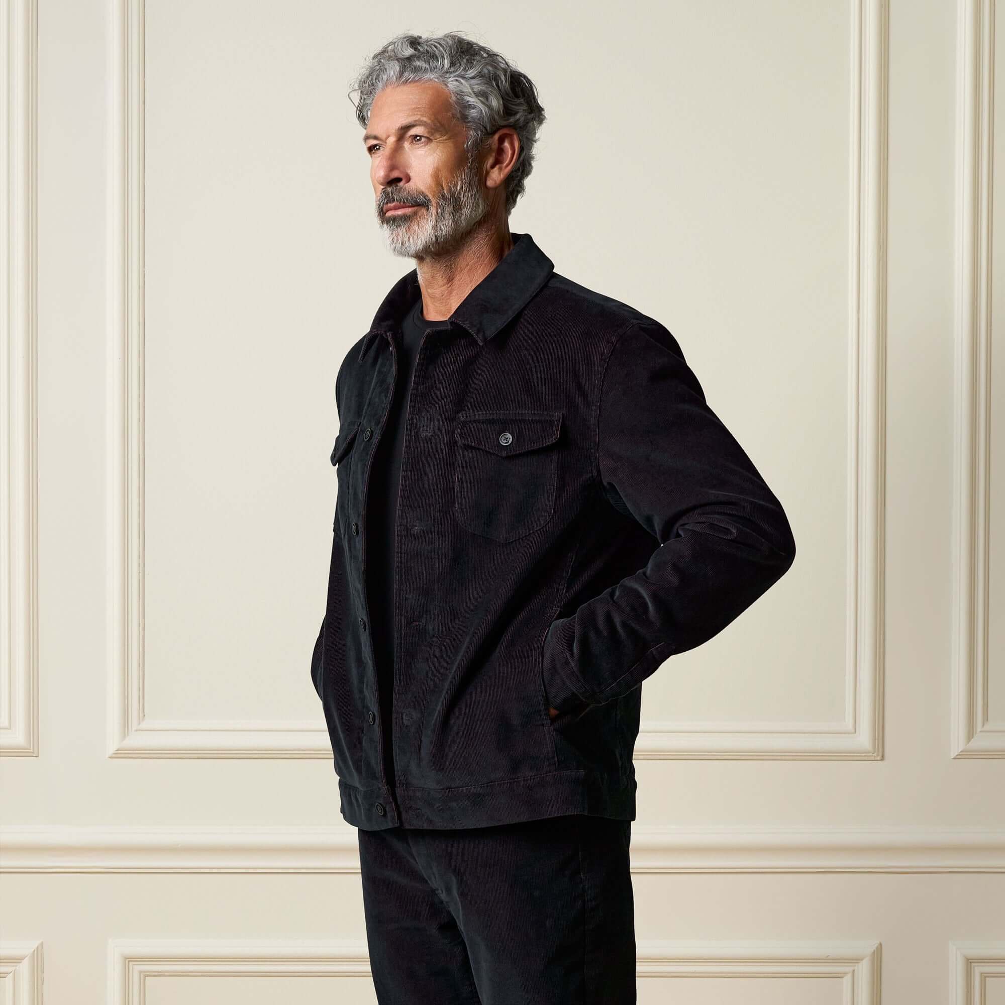 Model showcasing the Two-Tone Cord Jacket in Black with a modern design and soft sherpa lining.
