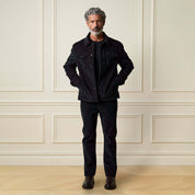 Two-Tone Cord Jacket in Black worn by a man, featuring a stylish button front and chest pockets.