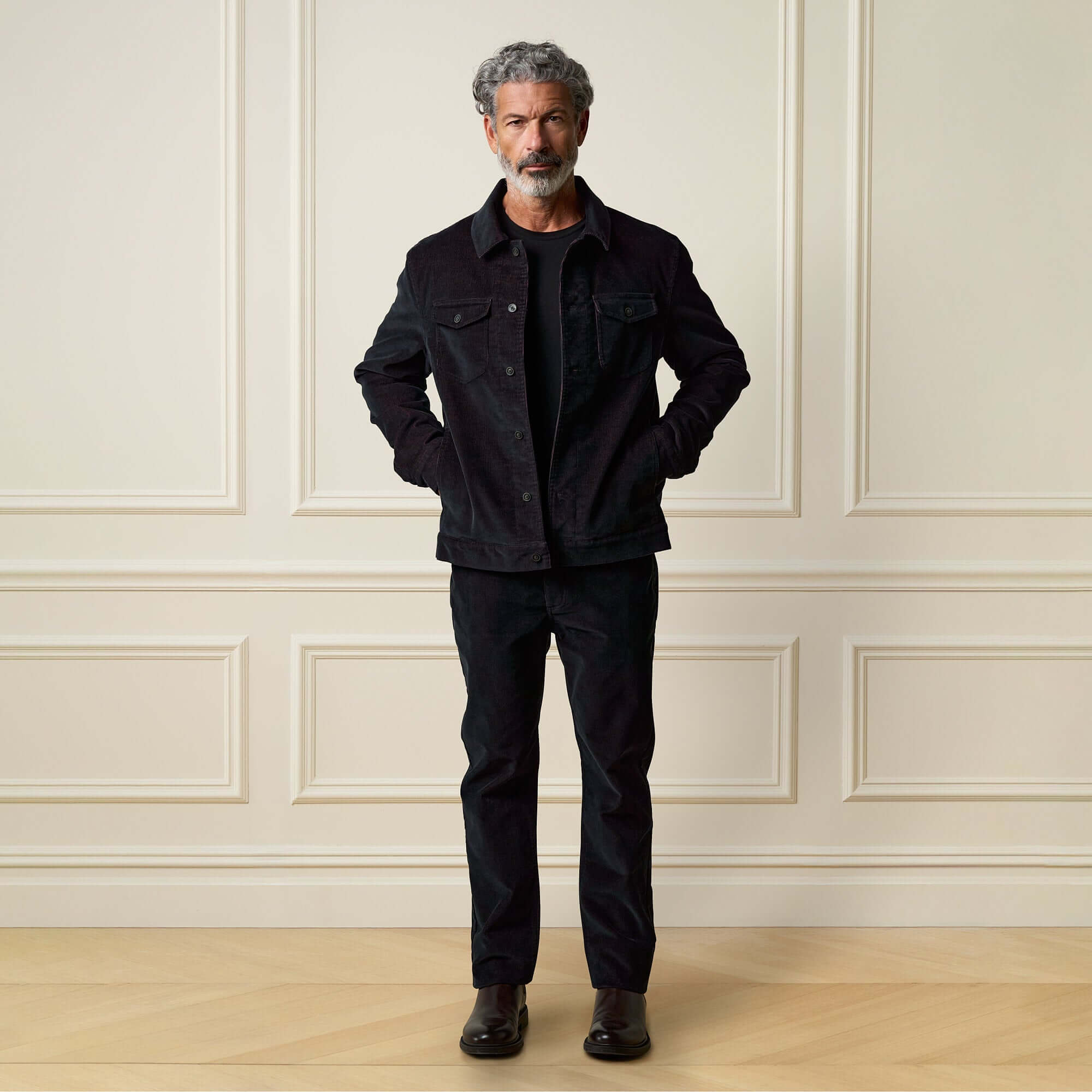 Two-Tone Cord Jacket in Black worn by a man, featuring a stylish button front and chest pockets.