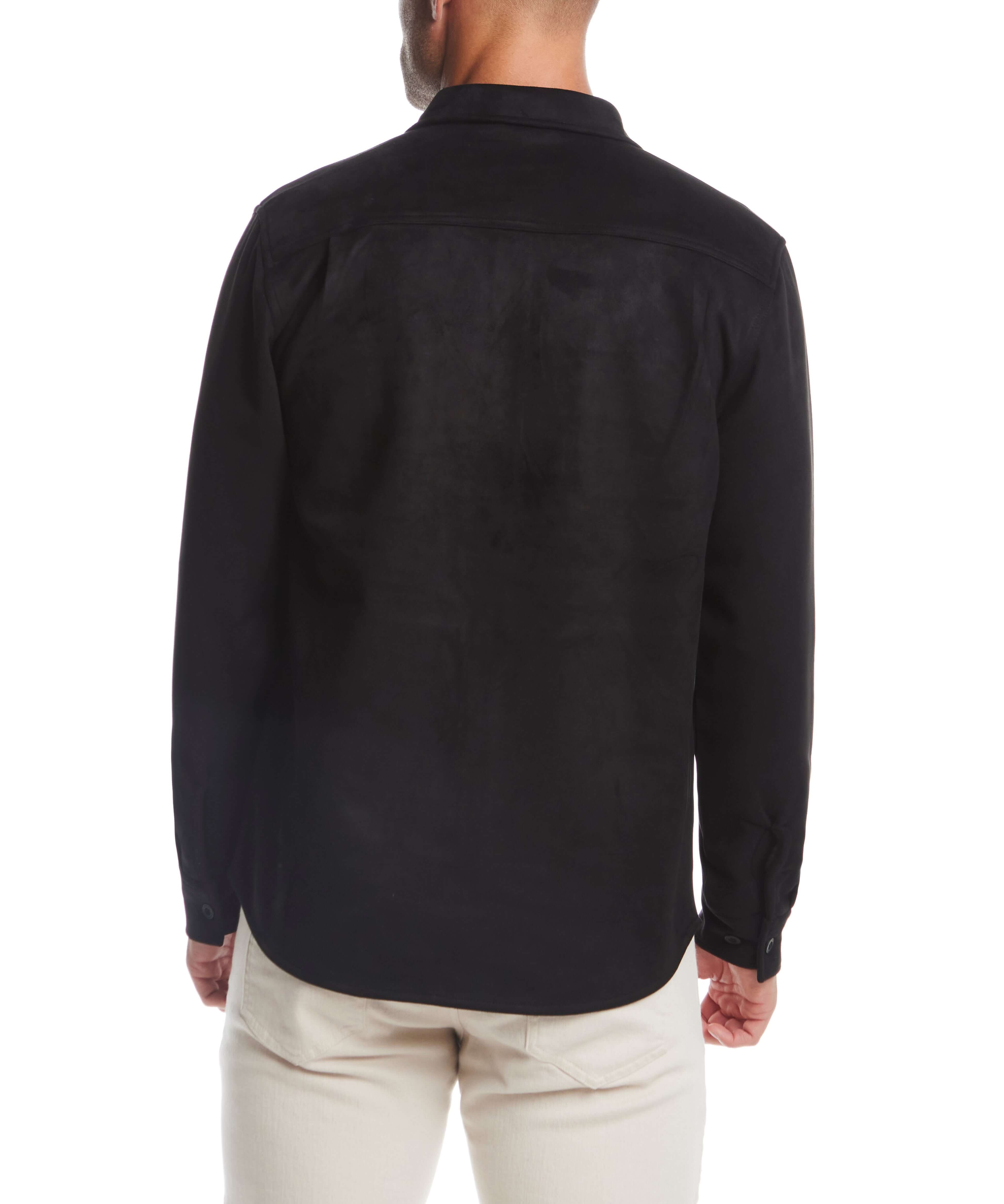 Back view of a man wearing an unlined black sueded shirt jacket, showcasing its soft fabric and stylish design.
