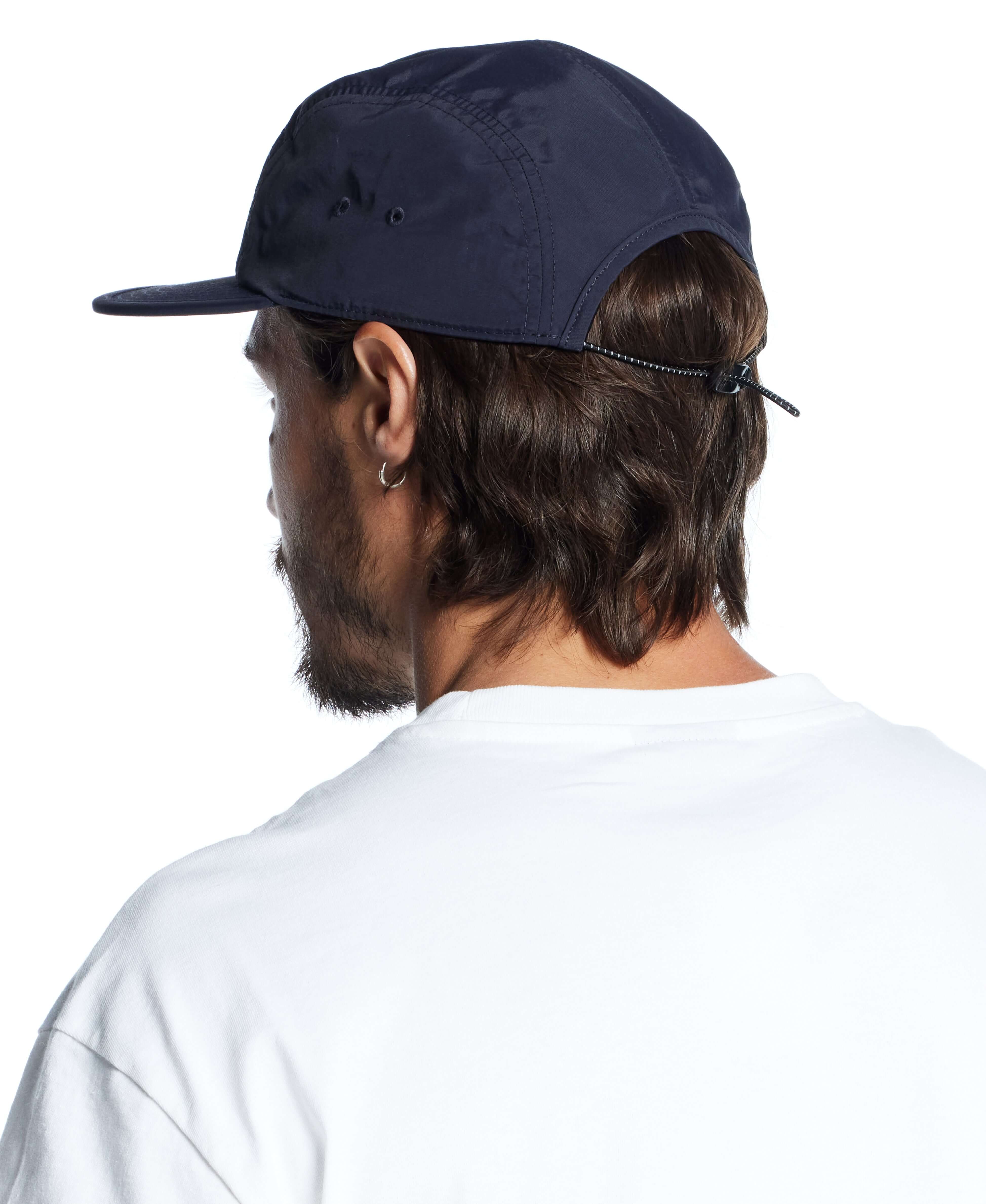Vintage navy jogger cap showcased from the back, highlighting its stylish design and adjustable strap.