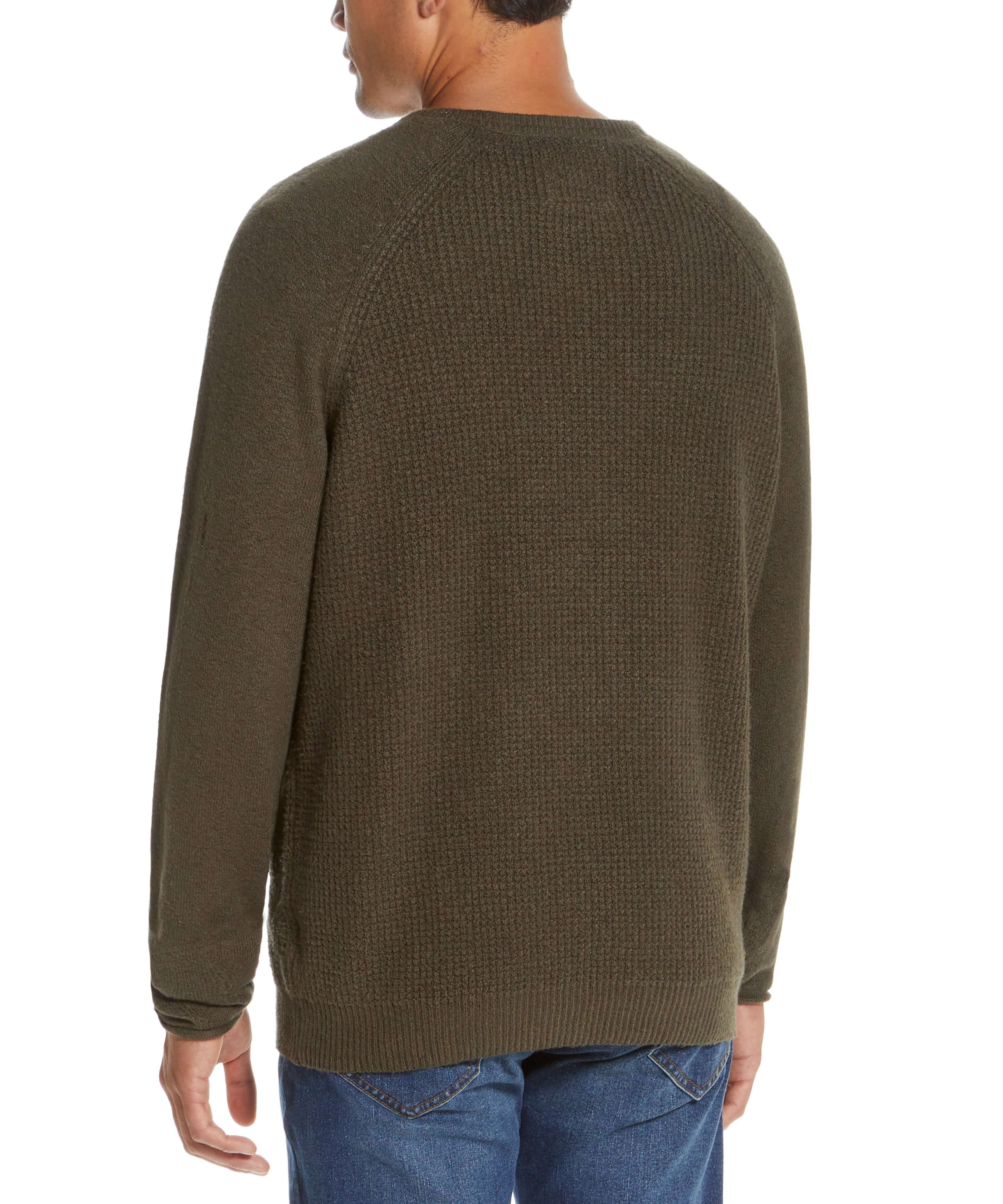 Back view of a man wearing a super soft chive waffle crewneck sweater, highlighting its lightweight and cozy texture.