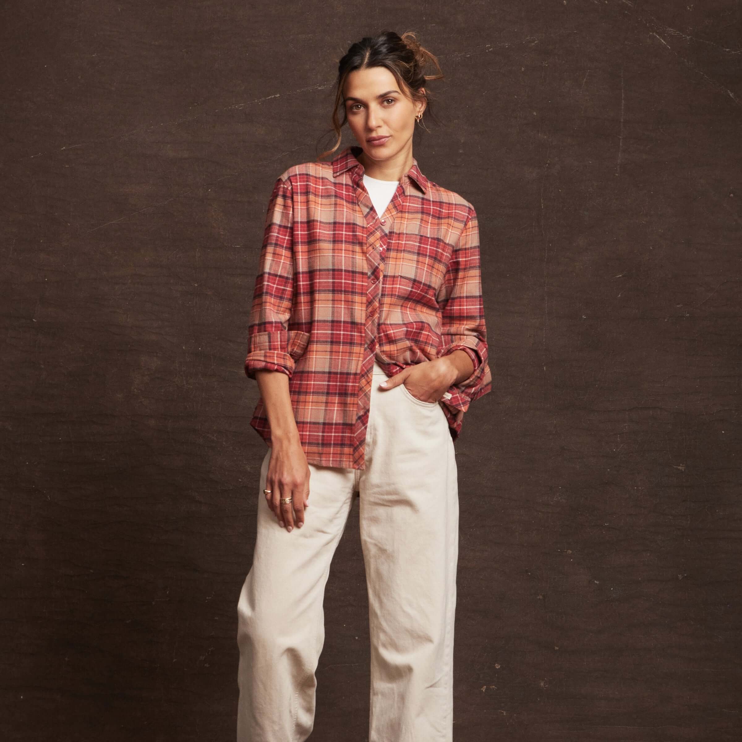Casual women's orange stretch flannel shirt with a notch V-neck, button closure, and rolled cuffs for comfort.