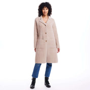 Women's plush coatigan in apricot with button closure and front pockets, perfect for fall layering.