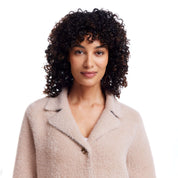 Model wearing Women's Plush Coatigan in apricot, showcasing the soft, stylish fabric and button closure.