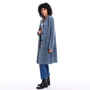 Stylish woman wearing a mid charcoal plush coatigan, featuring button closure and front pockets, perfect for fall weather.