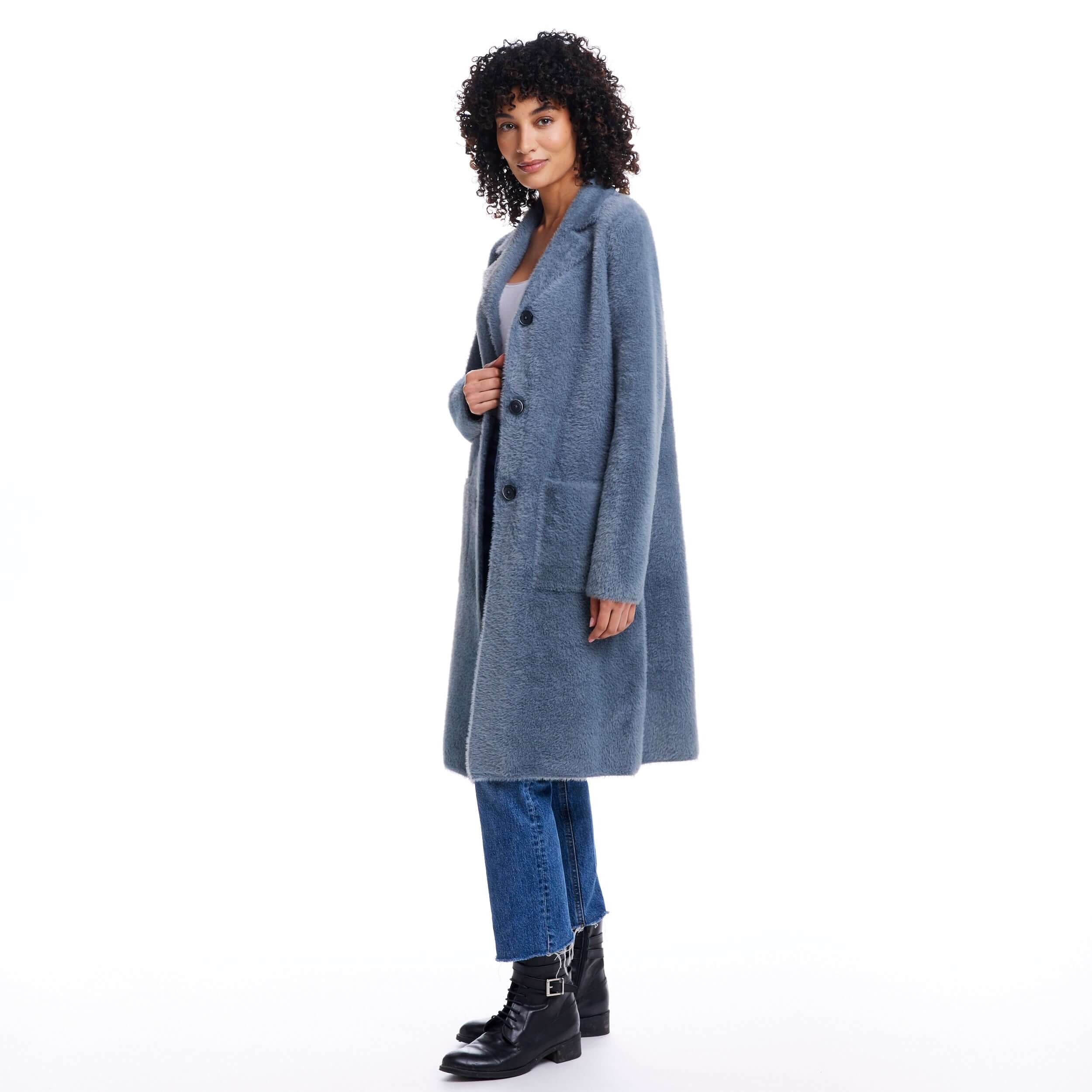 Stylish woman wearing a mid charcoal plush coatigan, featuring button closure and front pockets, perfect for fall weather.