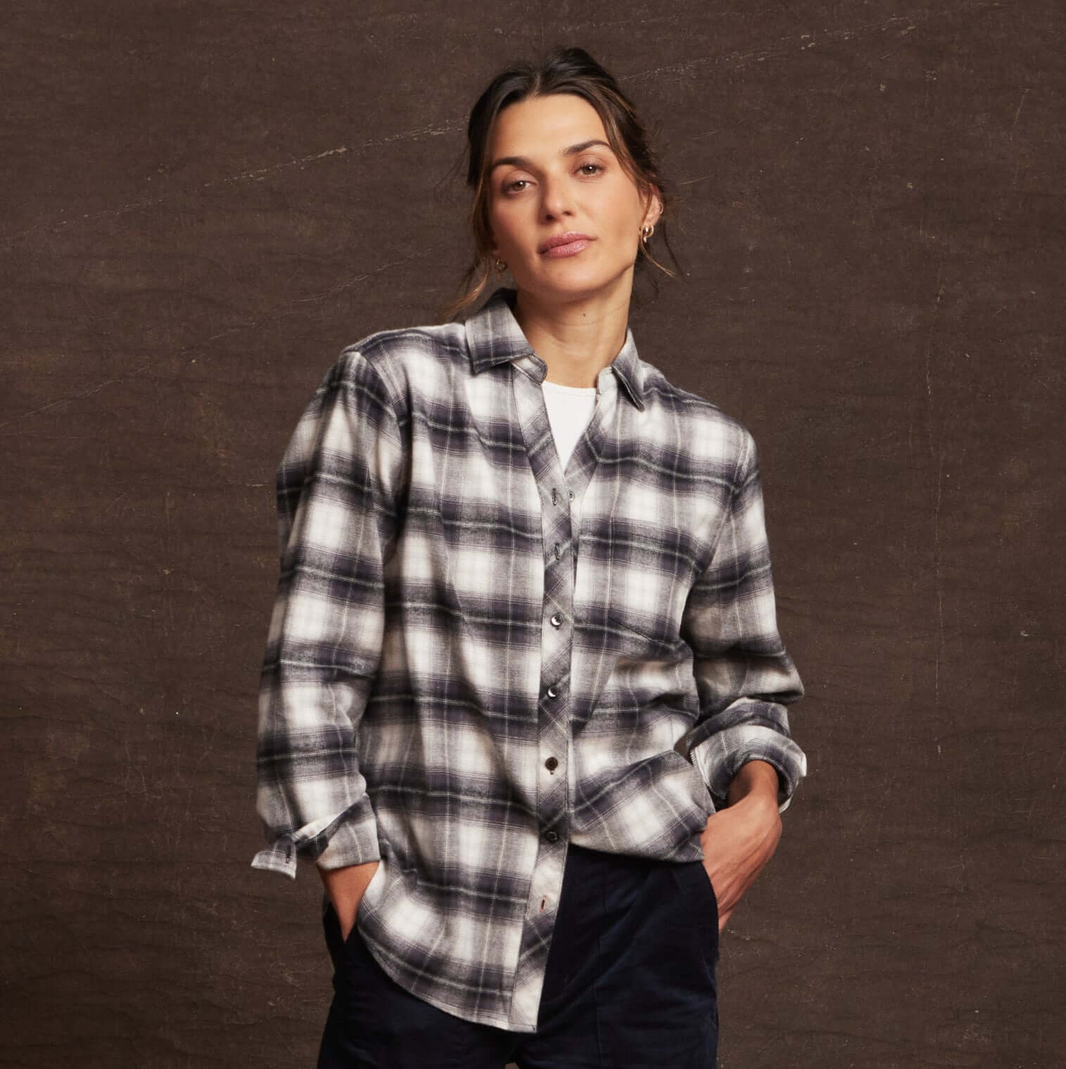 Women's black and white stretch flannel shirt with classic fit, notch V-neck, and rolled long sleeves.