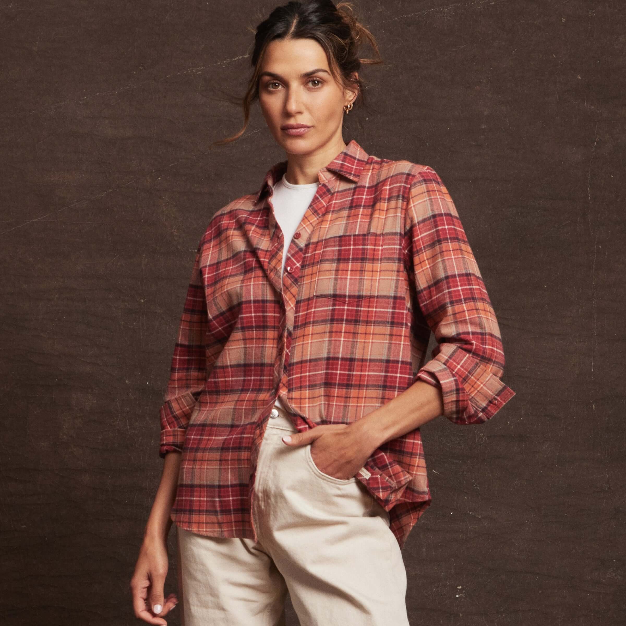 Women's orange stretch flannel shirt featuring a classic fit, notch V-neck, and rolled sleeves for a casual look.