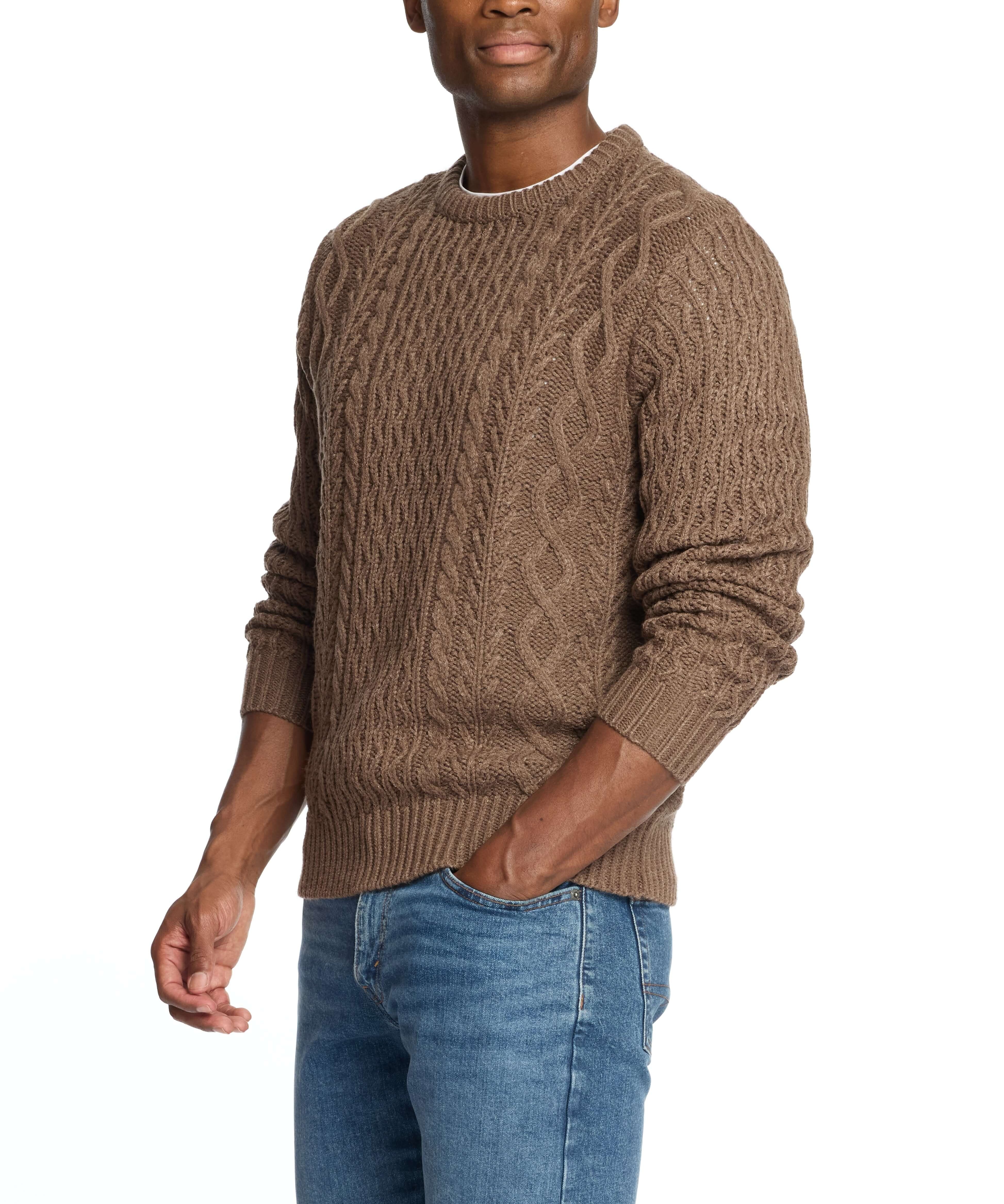 Man wearing a Zig Zag Cable Knit Crew in Flagstone, showcasing a chunky knit design and textured zig zag pattern.