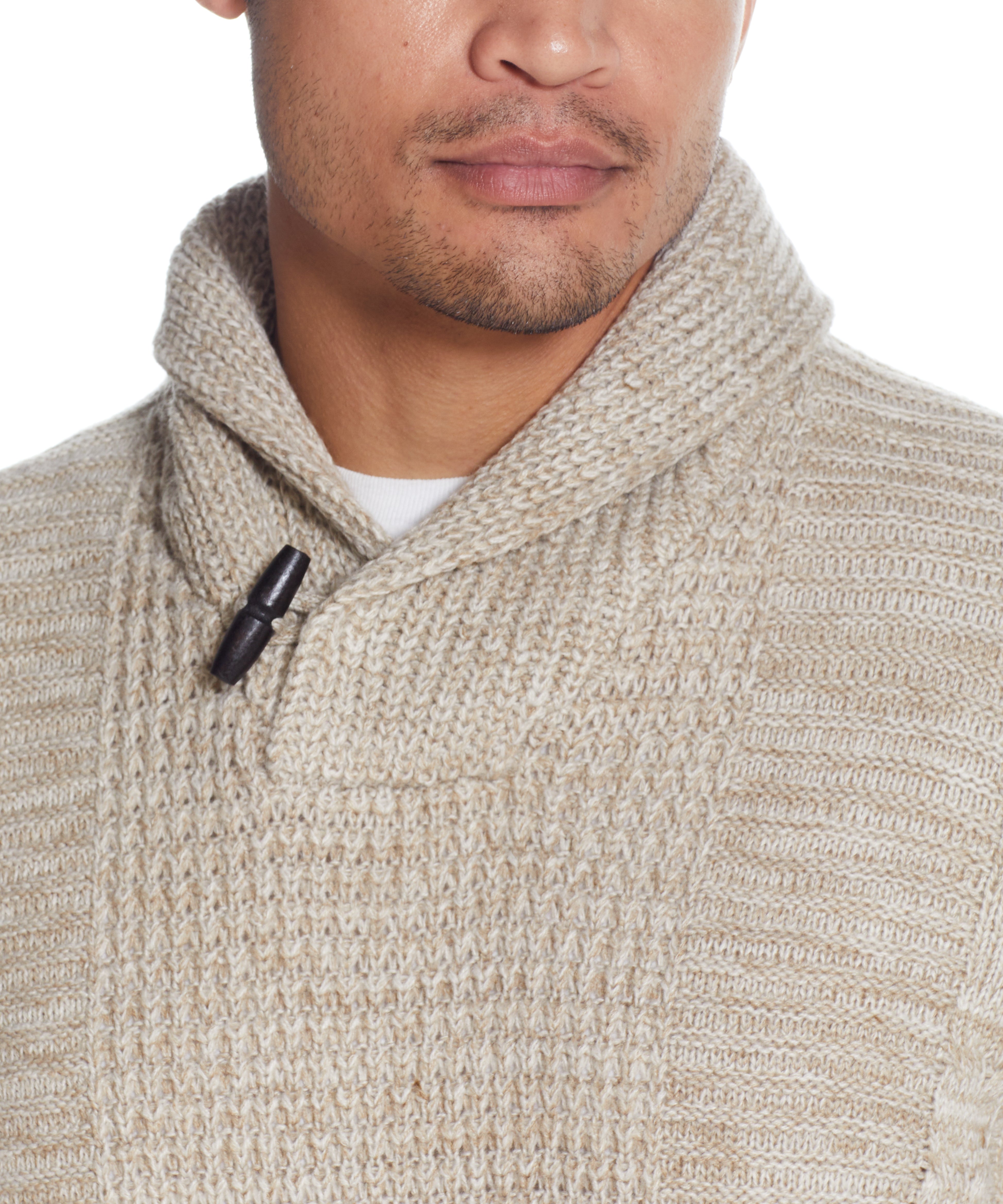 FISHERMAN SHAWL SWEATER IN LIGHT KHAKI showcasing a close-up of the cable pattern and toggle button detail.