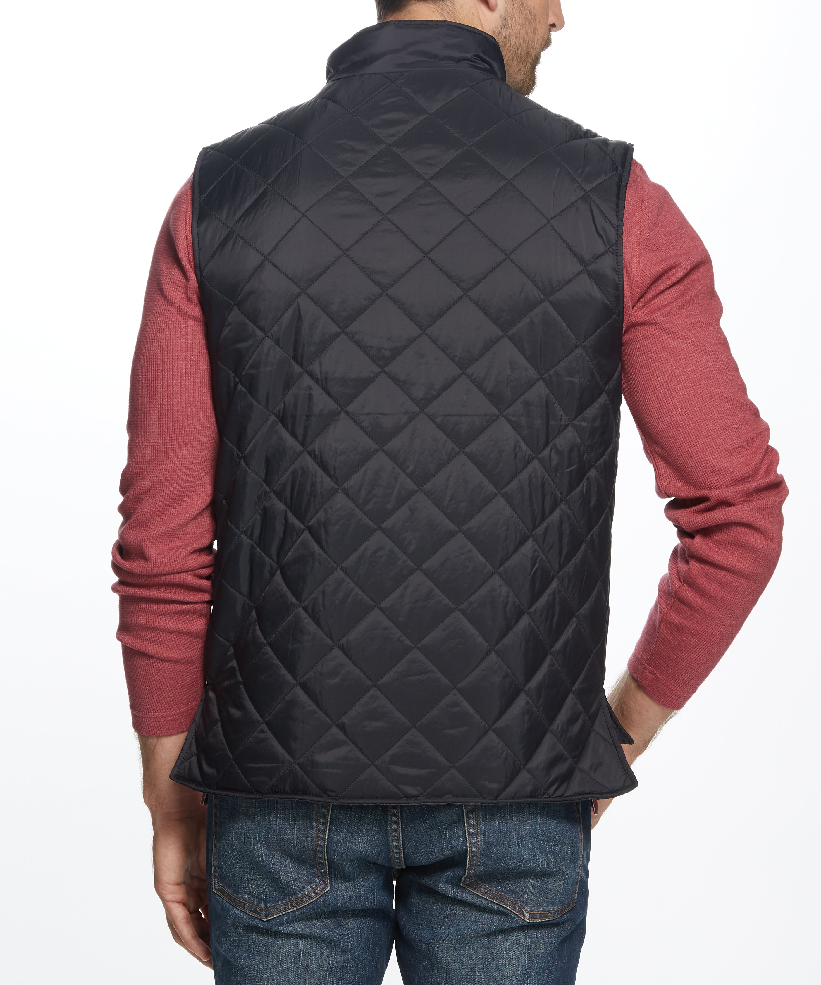 Man wearing a Diamond Quilted Vest in Black, showcasing the back view of the lightweight design.