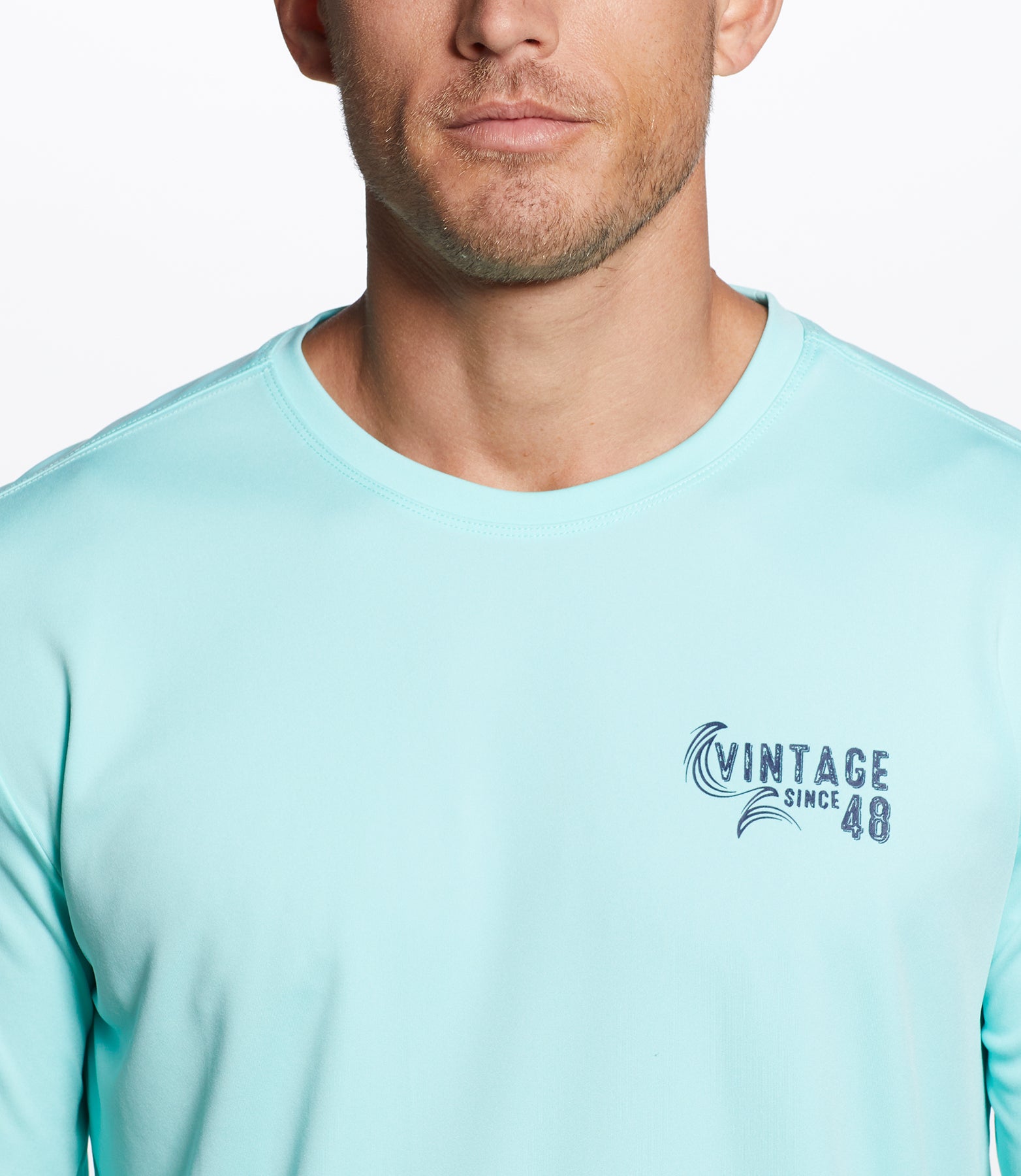Long Sleeve Sun Shirt Spf In Aruba Blue, showcasing a man wearing a light blue shirt with adventure graphics.