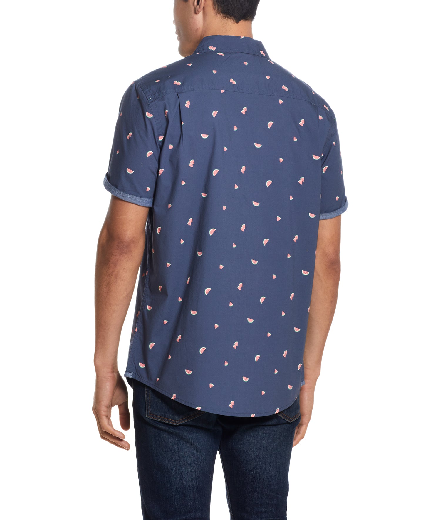 Back view of a man wearing the Peached Poplin Mini Print In Watermelon shirt featuring a playful mini print.